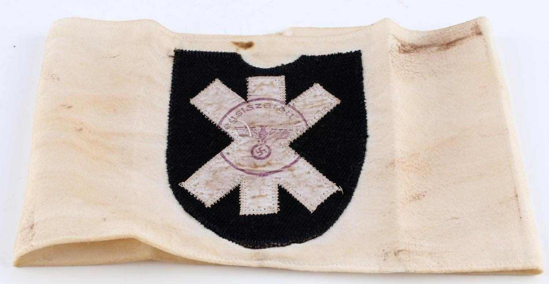 WWII GERMAN REICH SS MOUNTAIN DIV NORD ARMBAND: WWII German Reich SS Mountain Division "Nord" in good condition. Interior reads "Hauptsitz division Inspizirt 1943". "Wolfangel" design on front fluoresces and/or reflects; but stitching does not. Una