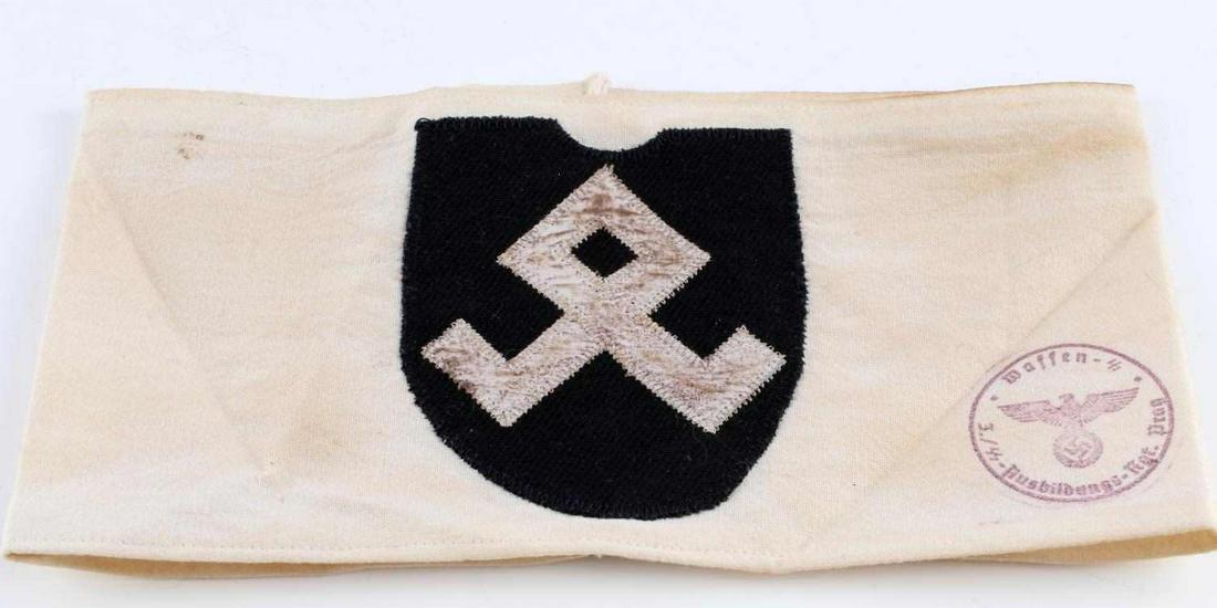 WWII GERMAN REICH PRINZ EUGEN SS DIVISION ARMBAND: WWII German Reich Prinz Eugen SS mountain Division armband in good condition. Interior reads "Hauptsitz Division Inspiziert 1943". Sports a Waffen-SS stamp on front. Design on front fluoresces and/or