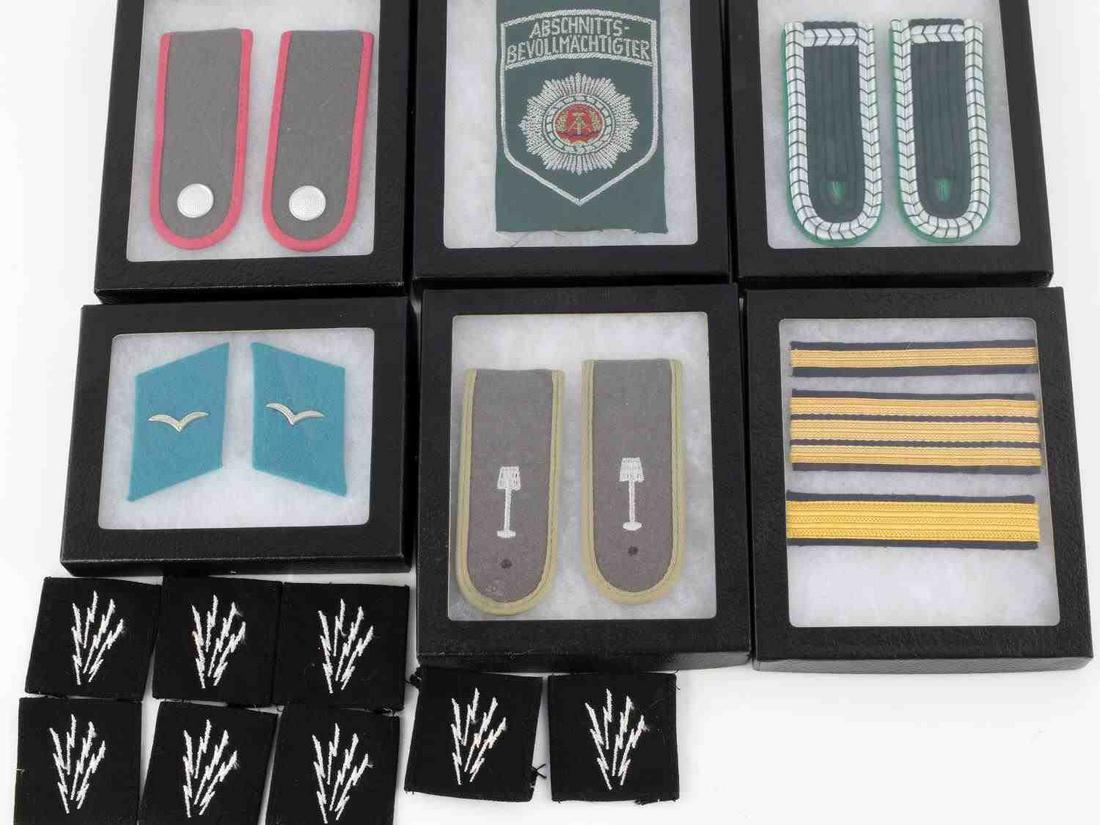 WWII THIRD REICH GERMAN MILITARY PATCHES LOT 12: U.S. Navy WWII radioman patches 6 of them. East German Navy Petty Officer's rank stripes, Underleutenant rank stripe, police badge, army conscientious objector shoulder boards, air force collar tabs, 