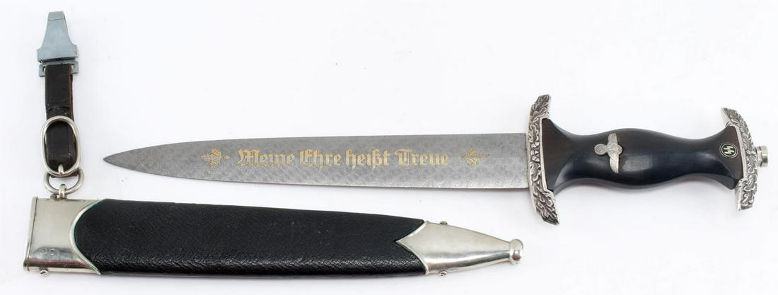 WWII GERMAN THIRD REICH WAFFEN SS DAGGER SCABBARD: WWII German Third Reich Waffen SS Dagger and Scabbard. Makers mark of "Carl Eickhorn Solingen". The blade is composed of a maidenhair style Damascus steel. Oak Leaves adorn each crossguard. Gold overl