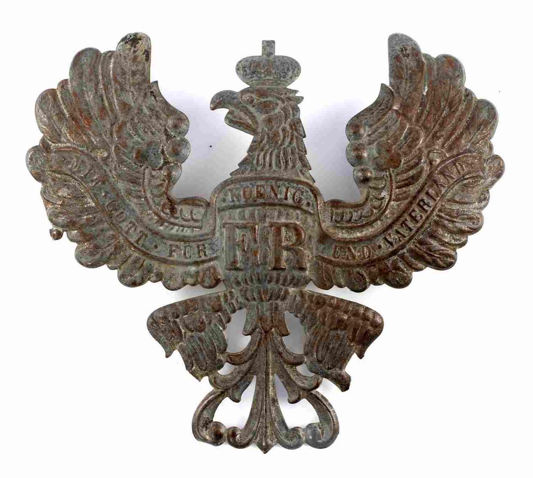 IMPERIAL GERMAN PRUSSIAN SPIKE HELMET FRONT PLATE: Measures 5 x 4 1/2 inches. Front shows spread winged eagle with king's crown on head. Reads "Mit - Gott - Fur - Koenig - und Vaterland FR." Two eyelets for securing to front of spiked helmet. Stamped 