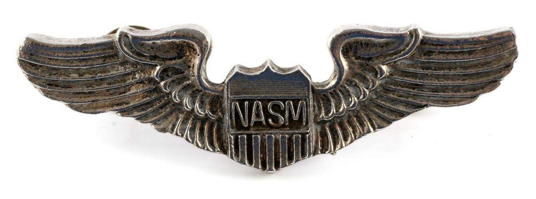 USAF VIETNAM ERA AIR FORCE NASM AVIATOR PILOT WING: 2 1/2 x 1 inch. Shield with 'NASM' at center. Flanked by wings. Two clutch back posts on back with brass brads. One piece nickel construction.