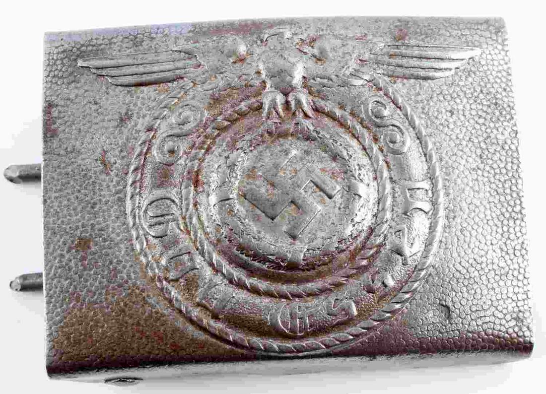 GERMAN WWII WAFFEN SS GAU ESSEN EM BELT BUCKLE: Measures 2 1/2 X 2 inches. Front reads "Gau Essen." Shows Waffen SS eagle clutching a swastika in talons. Includes both prongs plus belt hook. Stamped steel. For enlisted men. Unauthenticated, sold as