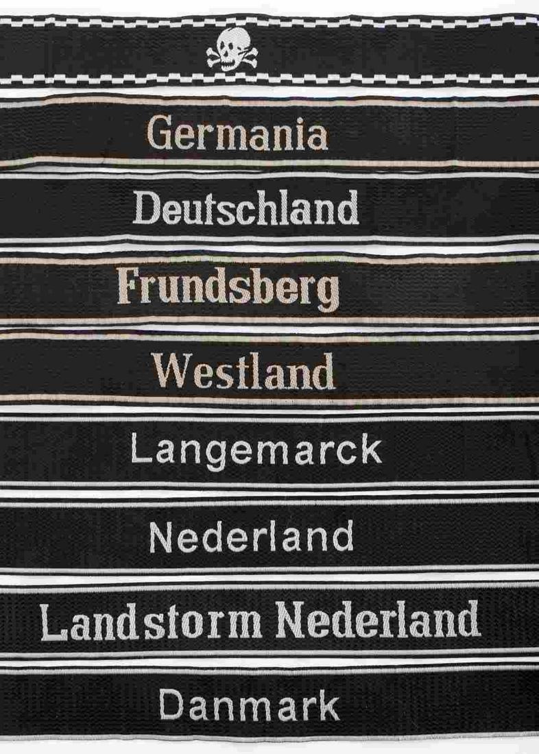LOT OF 9 WWII GERMAN THIRD REICH SS CUFF TITLES: German WWII Waffen SS EM Cuff Titles. Includes; Totenkopf Skull; Germania: Nederland; Langemarck; Westland; Deutschland; Landstorm Nederland; Denmark; Frundsburg. They measure approximately 22 inches 