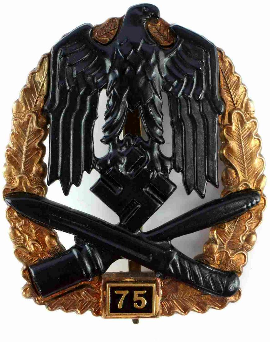WWII GERMAN THIRD REICH GENERAL ASSAULT BADGE: WWII German Third Reich Army 75 General Assault badge, measures approx. 2 X 2.5 inches. Awarded for 75 full days in combat. Oak wreath with eagle, NSDAP emblem and crossed bayonet / stick grenade. Bas