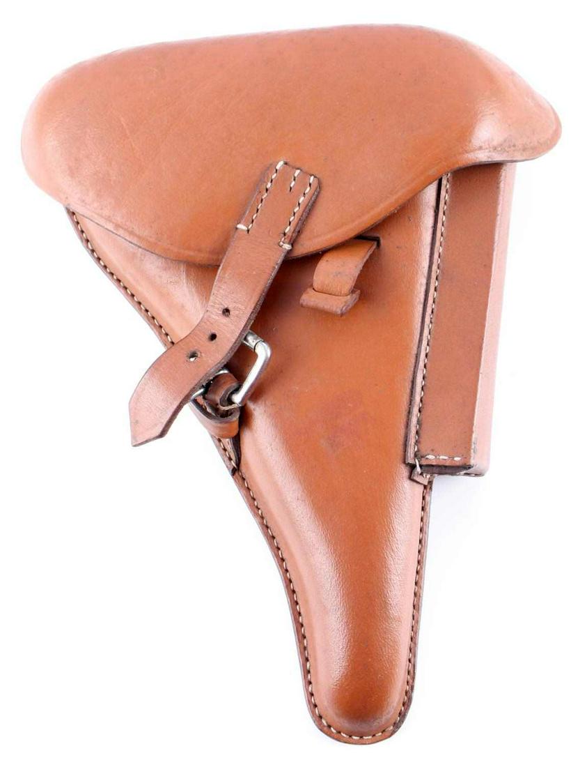 GERMAN WWII LUFTWAFFE AFRIKA KORPS LUGER HOLSTER: Measures 7 3/4 X 9 1/2 inches. Reverse side marked 'PO8 nka 43'. Marked with German Waffen eagle clutching swastika. Below it is marked 'WaA706'. Afrika Korps palm tree with swastika at center. Machin