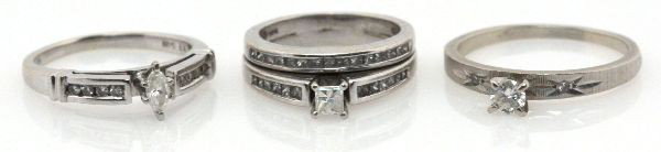 LADIES 14K WHITE GOLD DIAMOND ENGAGEMENT RING LOT: Size 4 wedding set with approx. 0.18ct princess cut diamond with (27) channel set diamonds totaling 0.4 ctw. Size 6 engagement ring with approx. 0.09ct marquise cut center diamond with (8) round cut c