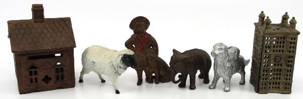 LOT OF 6 ANTIQUE AND REPRO CAST IRON BANKS: Included are vintage banks of a bank building and a boy with a dog. Banks of unknown age include a sheep, a dog and an elephant. A reproduction bank of a house is also included.