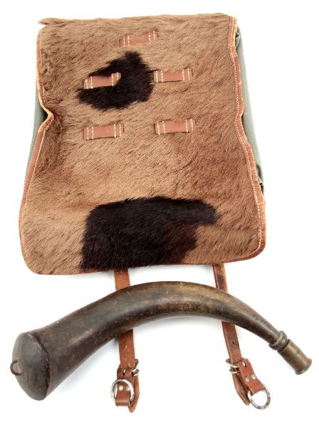 ANTIQUE POWDER HORN & WWII SWISS PONY BACKPACK: An antique 13 inch powder horn with a remade brass stopper and a WWII Swiss pony backpack in very good condition.