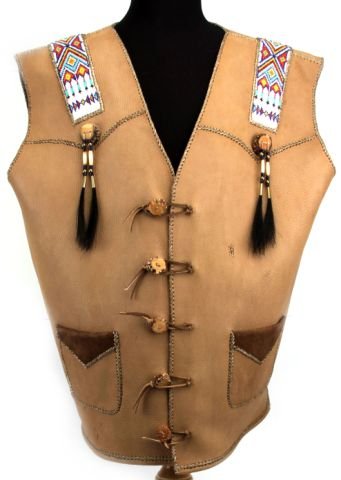 NATIVE AMERICAN BEADED LEATHER MOOSE VEST: A modern production Native American vest made from leather featuring beaded peyote stitching on the shoulders, antler buttons with hoarse hair, bone, glass and brass bead embellishments, and intricate