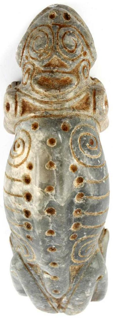 TAINO DOUBLE FACED CEMI STONE SPIRIT ARTIFACT: Double faced zoomorphic animal cemi. Initial face appears snake like. When looking down on the head a human-like face appears. The recumbent pose is similar to that of a dog. The only naturally occurr