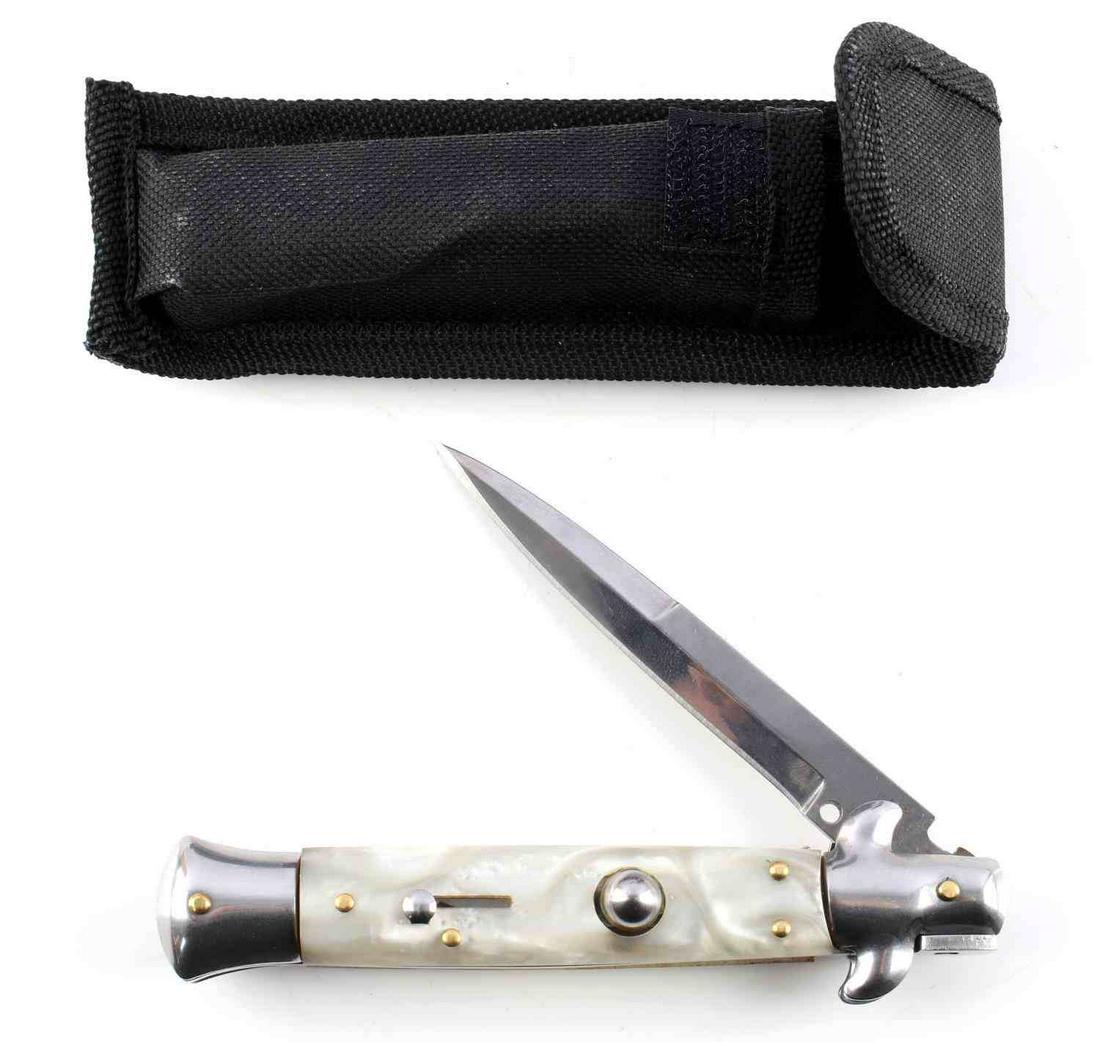 9 INCH AKC ITALIAN SWITCHBLADE MOTHER PEARL KINFE: AKC Italian made switchblade knife. 9 inches open. Stainless steel knife. Pearl-like grip. Very good condition.