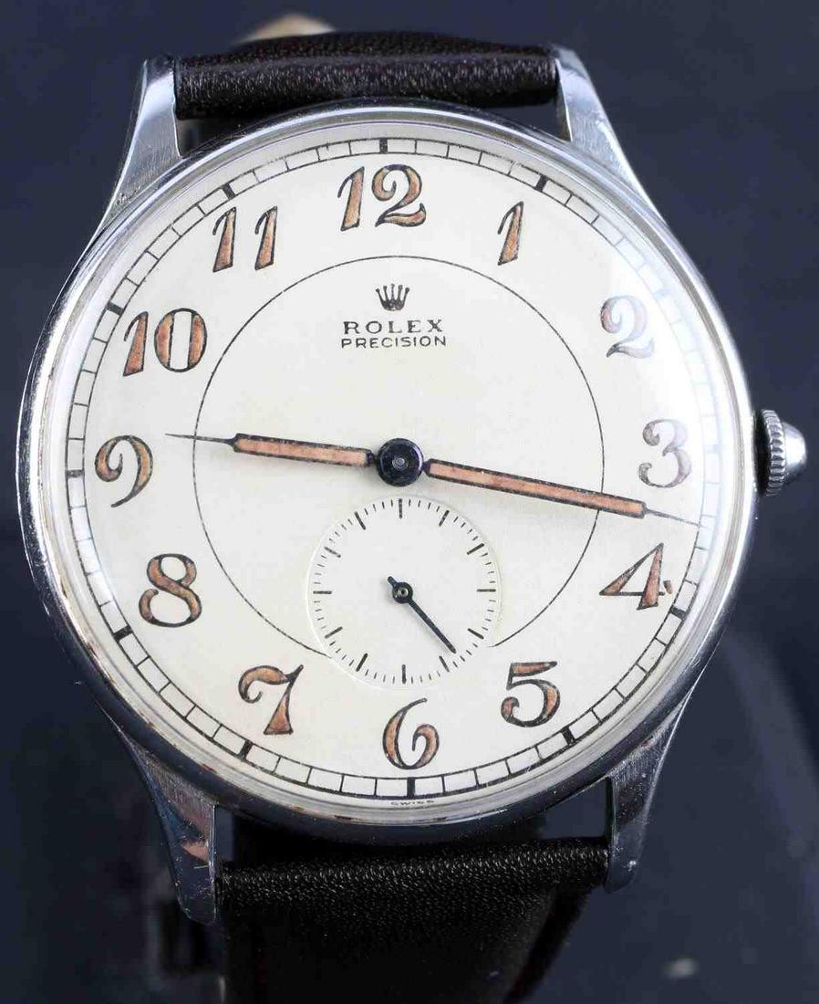 STAINLESS STEEL MENS ROLEX PRECISION CHRONOGRAPH: 38 millimeter, round, stainless steel case numbered 3675 with original face and hands. The back of the case is stamped 048206. Main dial is a two hand automatic movement while the seconds hand is on t