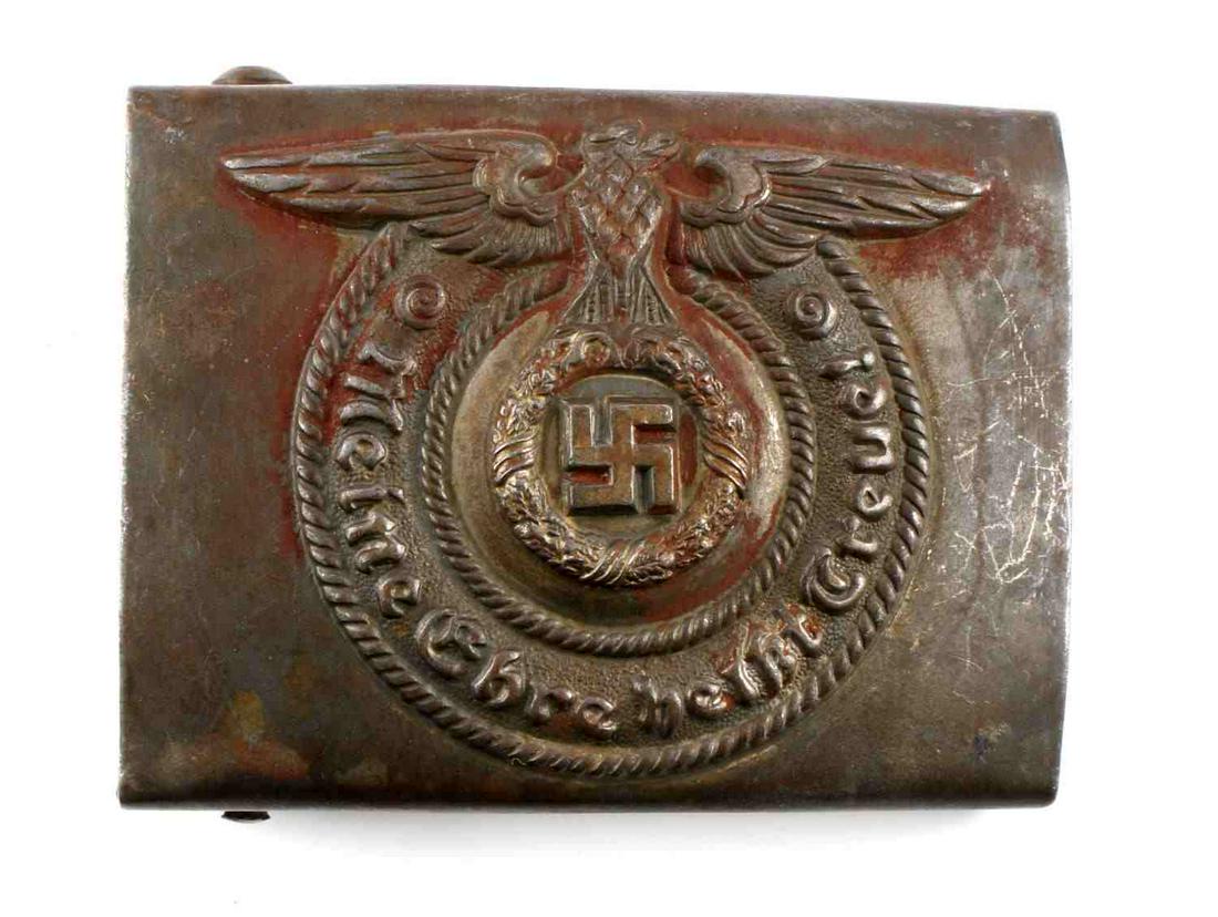WWII GERMAN THIRD REICH WAFFEN SS BELT BUCKLE: Steel belt buckle with Parteiadler and "Mein Ehre Heist Treue" border. Reverse marked RZM 155/40 SS. Good condition with age wear. Measures 2 1/2 inches.