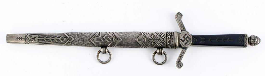 WWII GERMAN THIRD REICH LATVIAN OFFICER DAGGER: German WWII Third Reich Latvian Officers Dagger and Scabbard. Blade marked Carl Eickhorn Waffenfabrih Solingen. Dual channeled fuller on steel blade with steel scabbard and bakelite grip. Measures 13 