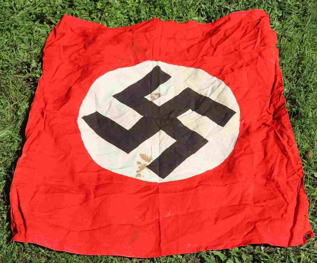 WWII GERMAN THIRD REICH NSDAP VEHICLE ID FLAG: WWII German Third Reich NSDAP vehicle ID flag, measures approx. 32 X 28 inches. Mild discoloration with minor creasing. One small hole towards center. Four grommets, multi-piece, single sided display.