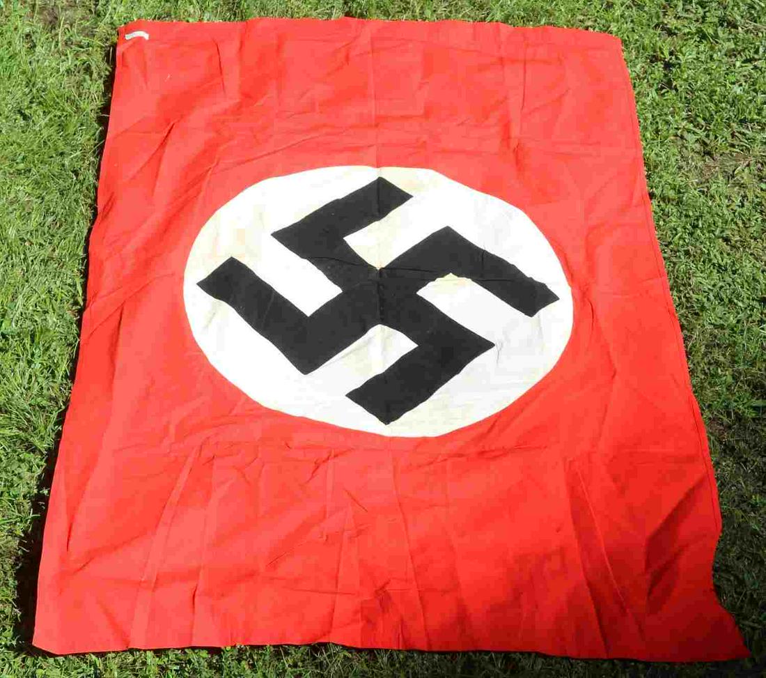 WWII GERMAN THIRD REICH NSDAP PARTY EMBLEM FLAG: WWII German Third Reich NSDAP party emblem flag, measures approx. 53 X 35 inches. Minor discoloration and staining on center emblem, no major damage. Double sided display, multi-piece with single hois