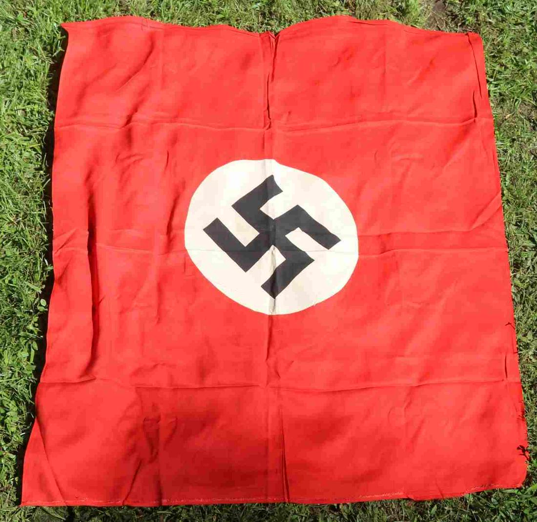 WWII GERMAN THIRD REICH NSDAP PART EMBLEM FLAG: WWII German Third Reich party emblem flag, measures 35 X 30 inches. Single sided display, one hoist and is a multi-piece. Minor creasing throughout. Non-Fluorescent. Very good original condition.
