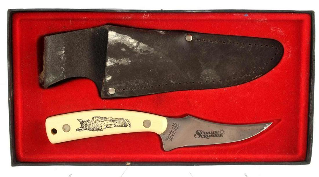 SCHRADE SCRIMSHAW SC502 FAWN SHARPFINGER KNIFE: Boxed 1985 Schrade Scrimshaw SC502 Sharpfinger Knife with deer fawn artwork. Signs of wear and use to blade, sheath and box. Knife extremely sharp still. Scrimshaw artwork on handle is artist signed a