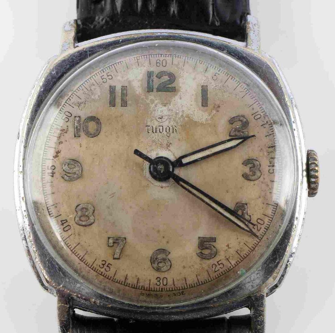 VINTAGE TUDOR 17 JEWEL PILOTS WRIST WATCH: Vintage Tudor 17 Jewel Pilots Wrist Watch. Starts and holds time. Steel case with leather band. Face has age wear and paint loss on numbers. Serial number: 683669873. Case measures 29.95mm. Good condi