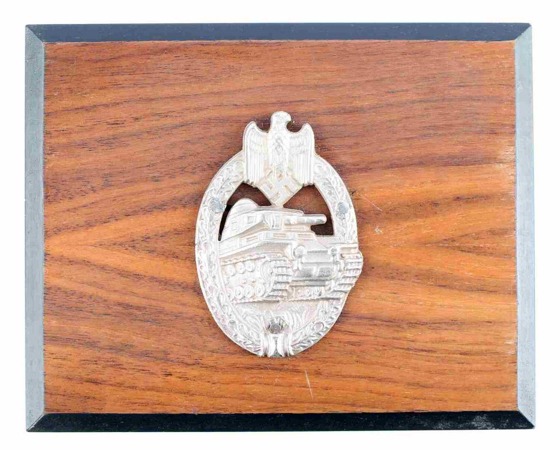 WWII GERMAN THIRD REICH SILVER PANZER TANK BADGE: Third Reich silver tank badge. Mounted on wood. Possible silver construction. Not tested due to mount. Cannot see reverse. Badge measures 2 1/2 inches. Mount measures 4 x 5 inches. Good condition. Una