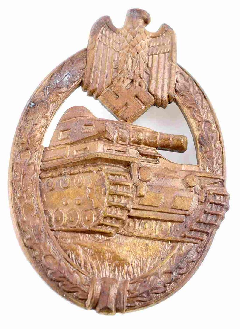 WWII GERMAN THIRD REICH BRONZE PANZER TANK BADGE: Third Reich bronze tank badge. Measures 2 1/4 inches. Reverse marked R S & S. Pin lays 180 degrees. Good condition. Unauthenticated, sold as is.