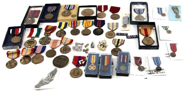 COLLECTION OF WWII TO DESERT STORM MEDAL LOT: A grouping of over 30 pieces from WWII to desert storm, including: a few commemoratives (some insignia), mini medals and some ribbons. Good variety.