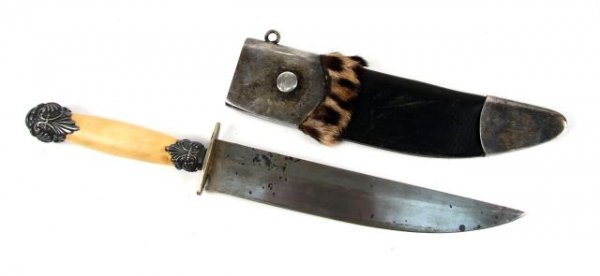 MEDIUM KNIFE WITH ORNATE STERLING AND IVORY HANDLE: Medium sized knife with 9 inch single edge blade. Crudely stamped spurious plate with "W&S Butcher" (a high quality Bowie knife maker) on back edge. Handle is ivory with silver ferrule and butt cap. B