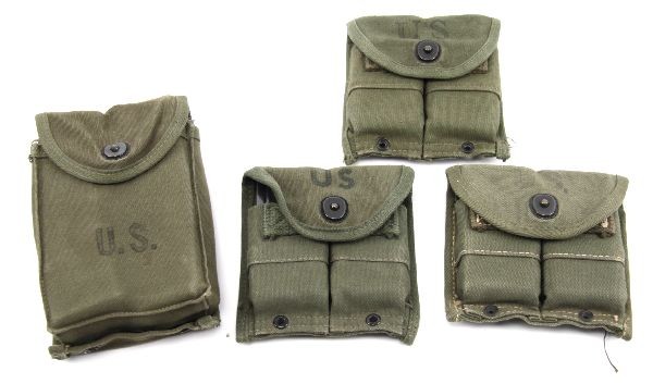 LOT OF 10 US M-1 CARBINE MAGAZINES AND POUCHES: (10) US issue magazines for US Carbine M-1. (6) 15 shot and (4) 30 shot. All are in US issue canvas pouches. All in good condition.