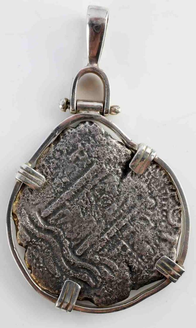 SHIPWRECK CONSOLACION 1600'S STERLING COIN PENDANT: Genuine 8 Reales cob, piece of 8, salvaged from the treasure ship Consolacion, which sank in 1681. Coin is set in a sterling bezel with 4 prongs and a large hinged bail. Bail is stamped "925". Entire 
