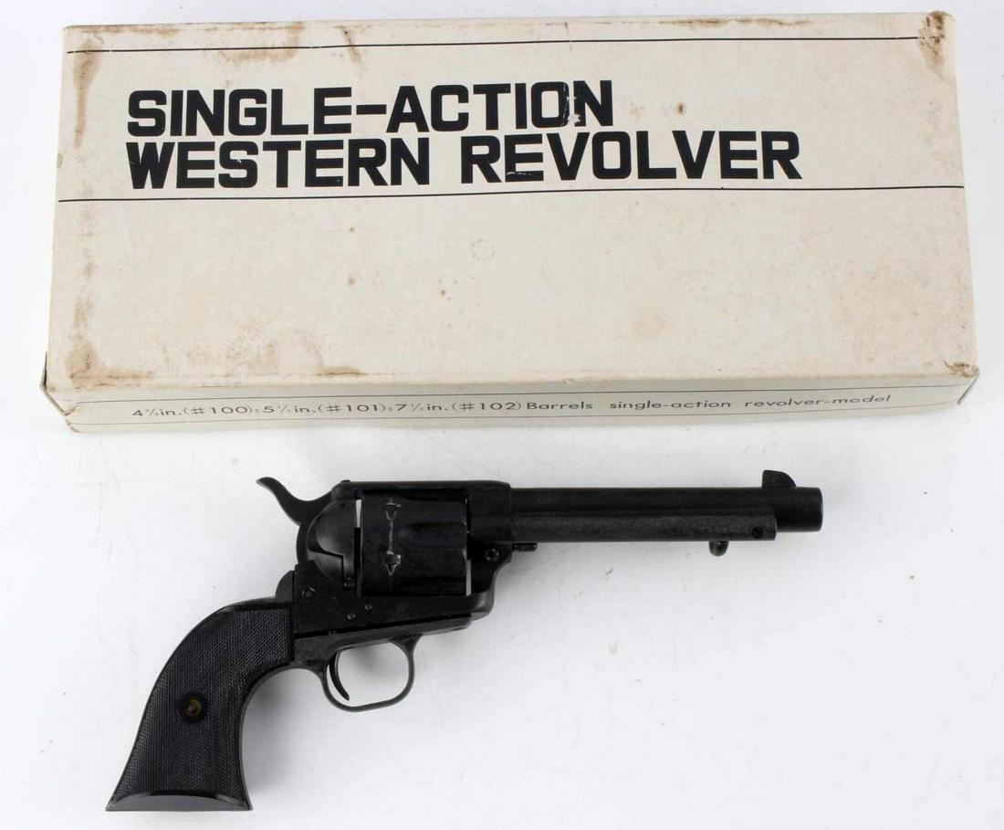 RMI VINTAGE HOLLYWOOD SINGLE ACTION REVOLVER PROP: RMI single action revolver model/prop. Model Single Action Army 45 marked to left of barrel. Model 1874 RMI marked to left of frame. Measures 11 1/2 inches altogether. Does not fire. Some age wear but