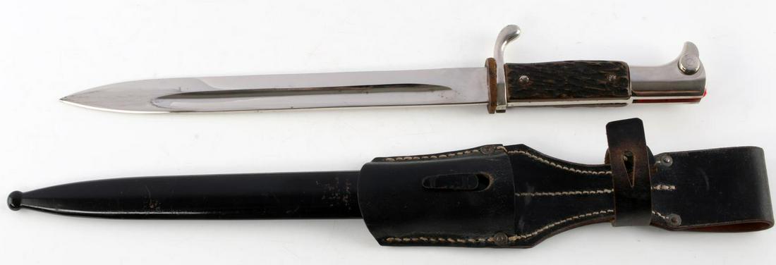 WWII GERMAN EICKHORN DRESS WALKING OUT BAYONET: Excellent example, stag grips, black leather 1942 dated frog, 90% paint dent free scabbard, near mint blade.