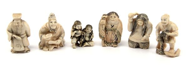 SIX SIGNED CARVED IVORY NETSUKE FIGURES: A grouping of six carved ivory netsuke figures. A 2 ich monk with fan and begging bowl, 2 inch immortal figure with scroll, 1.75 inch rounded old man with staff, 2 inch old fisherman gathering his net