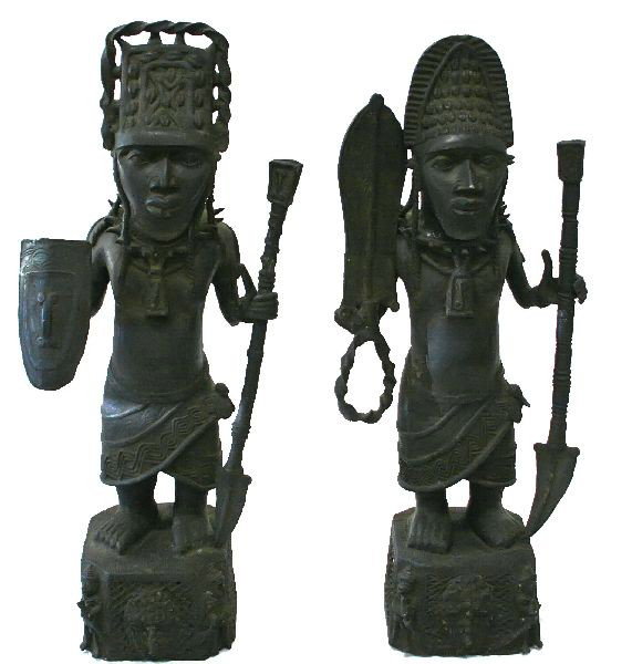 PAIR OF BENIN STYLE BRONZE WARRIOR STATUES: Pair of Benin style bronze warriors standing with spears and shields. Great detail, with good patina, measuring approximately 33 and 34 inches high.
