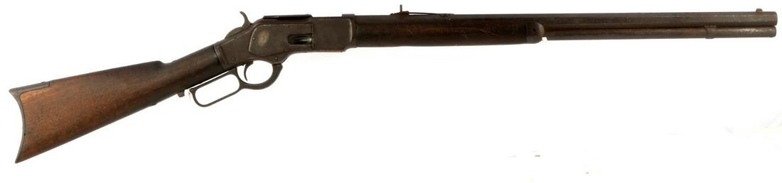 EARLY WINCHESTER KINGS LEVER ACTION RIFLE .44 CAL: 1880's manufacture. Winchester 1873 with 24 inch octagonal barrel with dark bore, some pitting, maker marked to top barrel flat with King's Improvement-Patented-March 29, 1866, October 16, 1860, .44 c