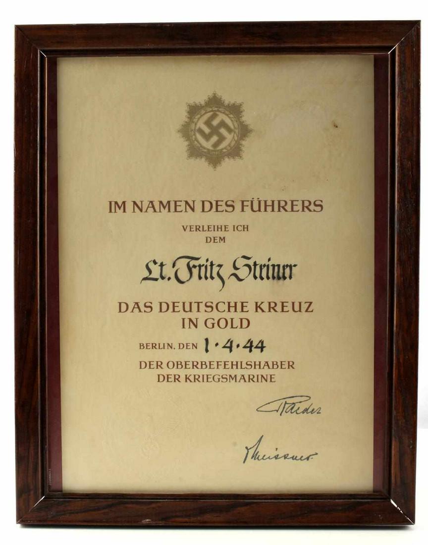 WWII GERMAN THIRD REICH GERMAN CROSS CERTIFICATE: The German Cross In Gold award certificate to Fritz Steiner in April 1944, signed by hand Eric Raider, with official seal framed 12 by 15, document measures 13 by 9 inches.