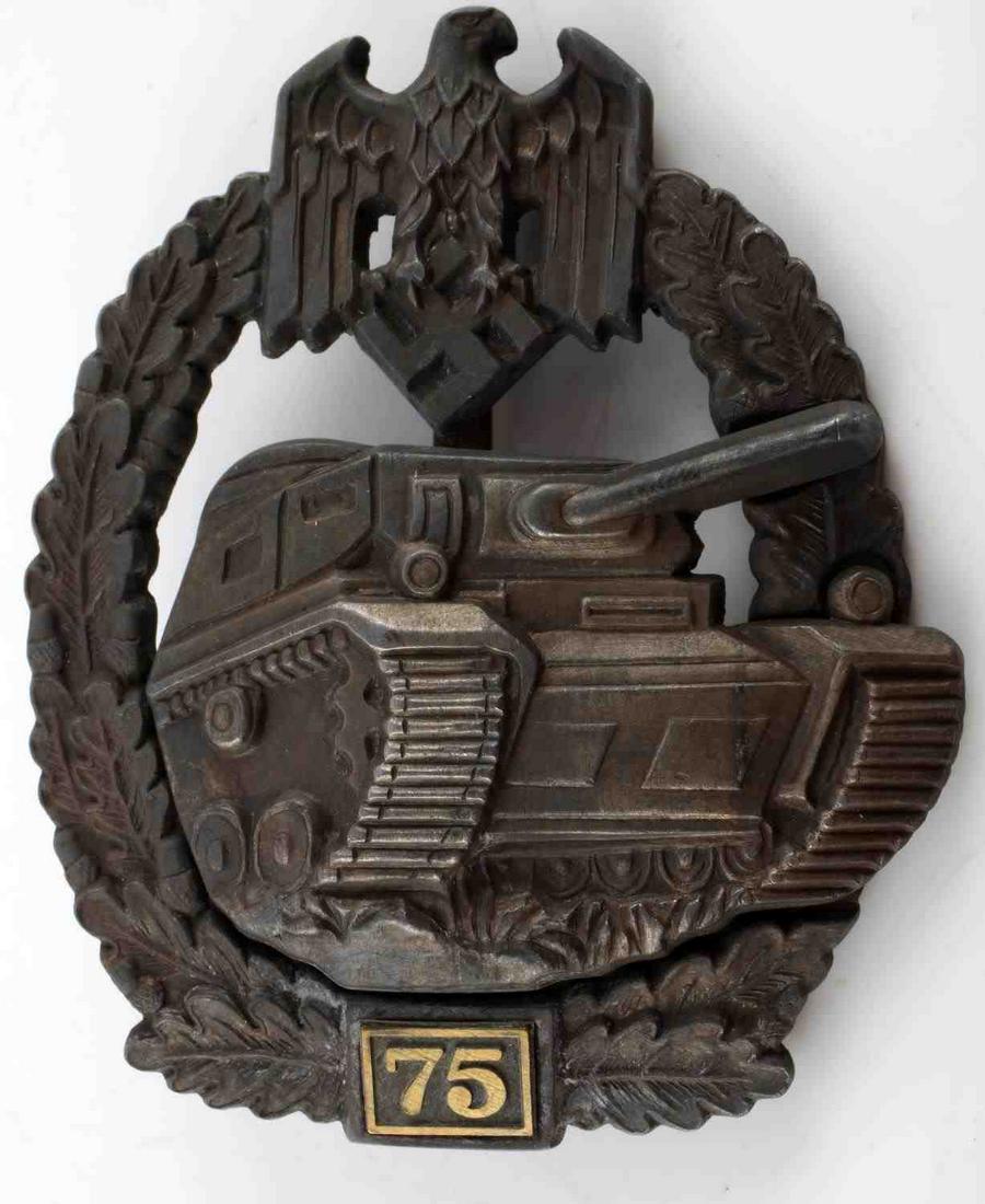 WWII GERMAN THIRD REICH 75 PANZER ASSAULT BADGE: Third Reich panzer assault badge for 75 assaults. Gold finish has worn away. Zinc construction. Wide vertical pin with C catch. JFS maker marked to reverse. Very good condition with very fine details.