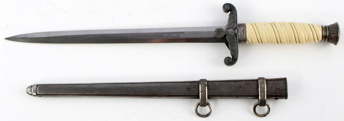 WWII GERMAN HEER OFFICERS DAGGER WITH SCABBARD: WWII German Heer Officer's Dagger with scabbard. Nickel pommel and crossguard with oak leaf designs and a Reichsadler to the crossguard. Off-white celluloid grip. Very good blade marked PIC. Tang mark