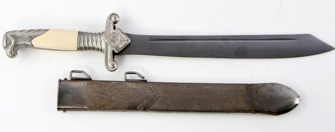 WWII GERMAN RAD OFFICERS DAGGER WITH SCABBARD: WWII German RAD (Reichsarbeitsdienst) personalized Officer's dagger with scabbard. Nickel Eagle head pommel and RAD insignia crossguard. Off-white celluloid grips. Blade etched "Arbeit adelt" and the 