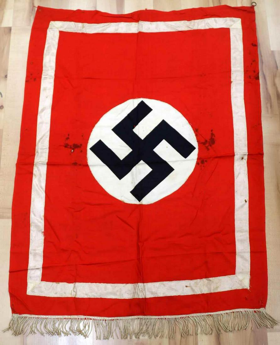 WWII GERMAN THIRD REICH SILK NATIONAL PARTY FLAG: Third Reich silk national party flag. Red, white, and black banner with national party symbol. Silk interior with silk bullion fringe. Measures Silk and cotton construction. Measures 41 x 29 1/2 inche