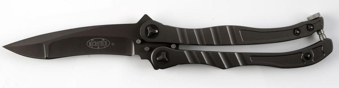 MICROTECH METALMARK BALISONG BUTTERFLY KNIFE: Microtech Metalmark aluminum Balisong butterfly knife. Measures approximately 5.5 inches when closed. Standard maker's mark present on the blade. Rare. Very fine condition overall.