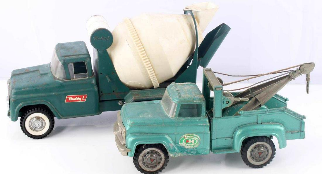 2 VINTAGE TOY TRUCKS CEMENT MIXER & TOW TRUCK: Buddy-L Cement Mixer truck, based on 1964 Ford. Lot includes Hubley Mighty Metal tow truck toy. Aging to the truck but still in working condition. Tow line and mechanism works well. Marked "Hubley Lan