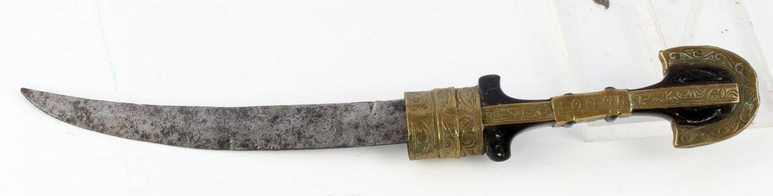 MOROCCAN JAMBIYA DAGGER NO SCABBARD: Curved blade measures 8.5 inches long, ornate wooden grip with tooled brass fittings and design. Blade has pitting and wear to tip, otherwise good condition. Scabbard is absent.