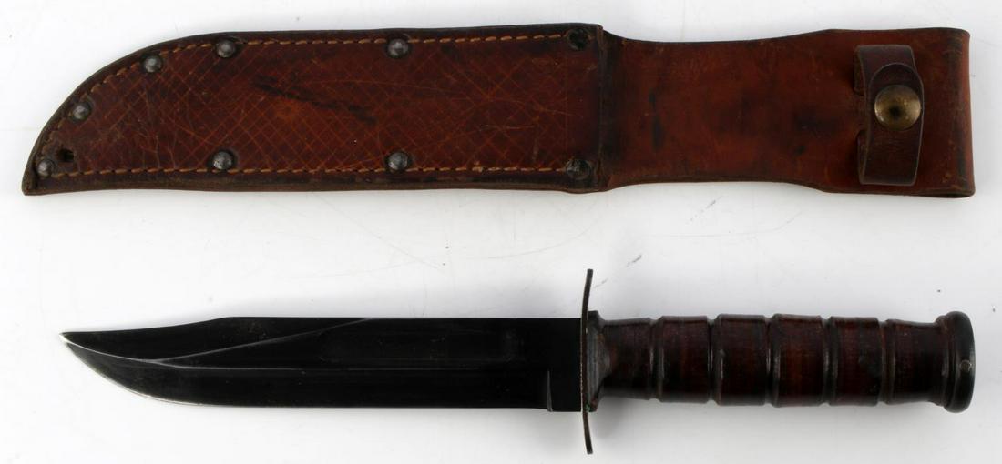 WWII U.S. NAVY MK 2 COMBAT FIGHTING KNIFE W SHEATH: WWII U.S. Navy Mark 2 Combat Fighting Knife with Sheath, measures 12 inches total with a 7 inch blade and 5 inch handle. Guard is marked "CAMILL U.S. N.Y. U.S.N. MARK 2." Blade is in very good origina