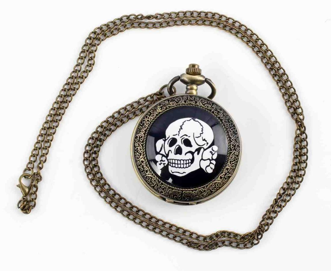 WWII GERMAN THIRD REICH POCKET WATCH W TOTENKOPF: Post war pocket watch with necklace chain. Totenkopf image on the outside. Unauthenticated, sold as is.