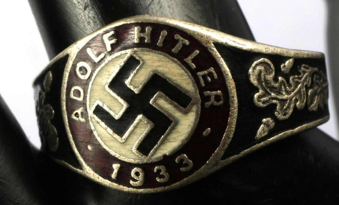 WWII GERMAN ADOLF HITLER SWASTIKA SILVER RING: Swastika to center with Hitler's name and 1933 on border, red and black enamel, and oak leaf design. Size 13, weighs 6.4 grams. Unauthenticated, sold as is.