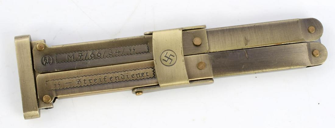 WWII GERMAN SS PARATROOPER BUTTERFLY KNIFE: Blade measures 3.75 inches with swastika at bottom, clearly marked to front, RZM M7/66/34/SS. Good condition. Unauthenticated, sold as is.