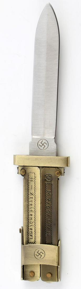 GERMAN WWII THIRD REICH WAFFEN SS FOLDING KNIFE: Bronze colored SS paratrooper style folding knife. Unauthenticated sold, as is.