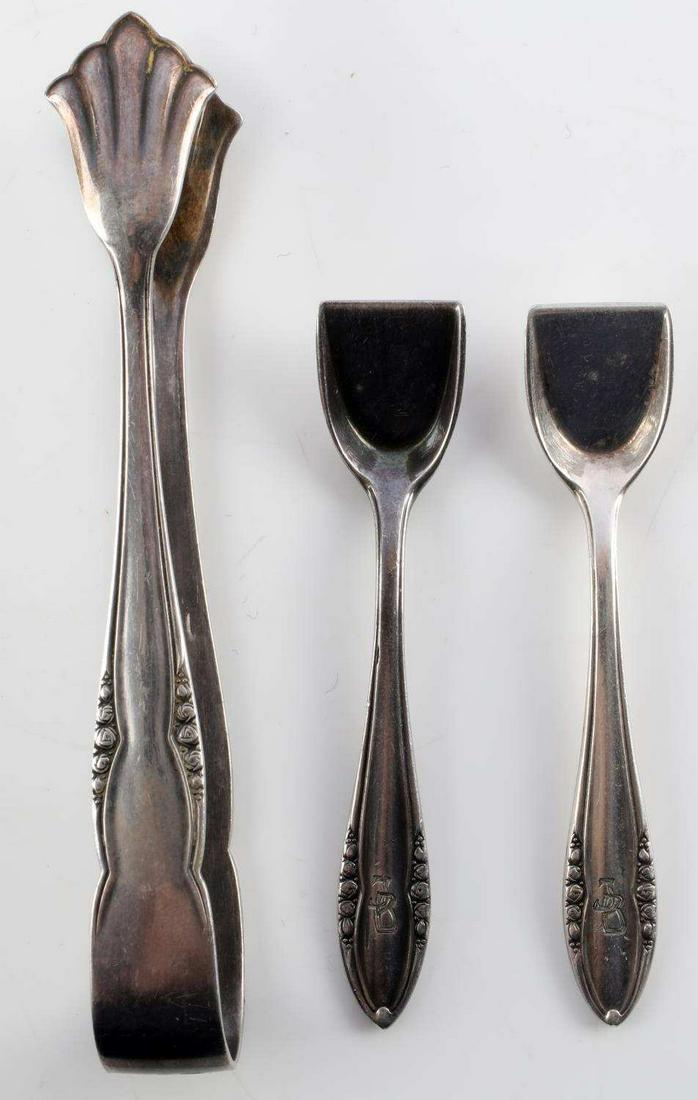 LOT OF 3 WWII GERMAN THIRD REICH SILVERWARE PIECES: Two salt spoons and sugar cube tongs. All marked SS Reich, JB and Wellner Silber with two cartouches. Acid tested for silver. 37.5 grams. Tongs measure 4 inches long. Salt spoons measure 3 inches long
