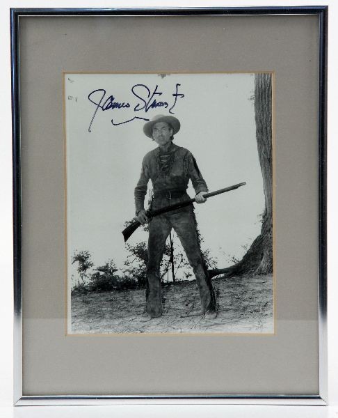 RARE JAMES STEWART HOW THE WEST WAS YOUNG PHOTO: A signed photo by actor James Stewart. 8 by 10 inch black and white (# 1776-46). Matted and in a simple frame. Not examined outside of frame. Signed in upper left corner.